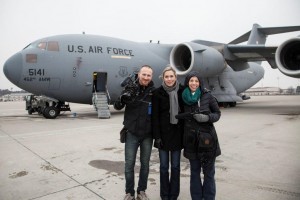 Cinematographer Jaka Vinsek, Director Carolyn Jones and Producer Lisa Frank in front of a military aircraft at Ramstein U.S. Air Base in Germany.
