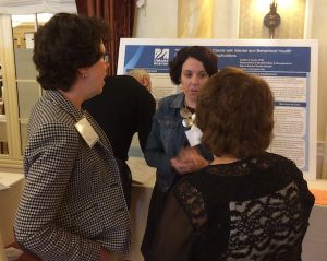 Nurses discuss poster session at healthcare workforce summit