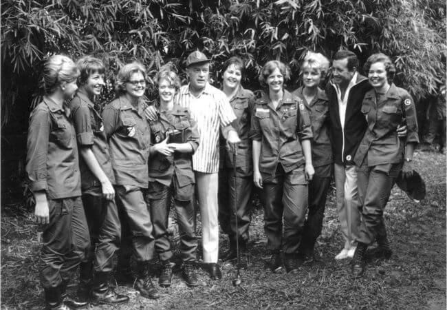 Bob Hope and Vic Damone stand with nurses from the 3rd Surgical Hospital