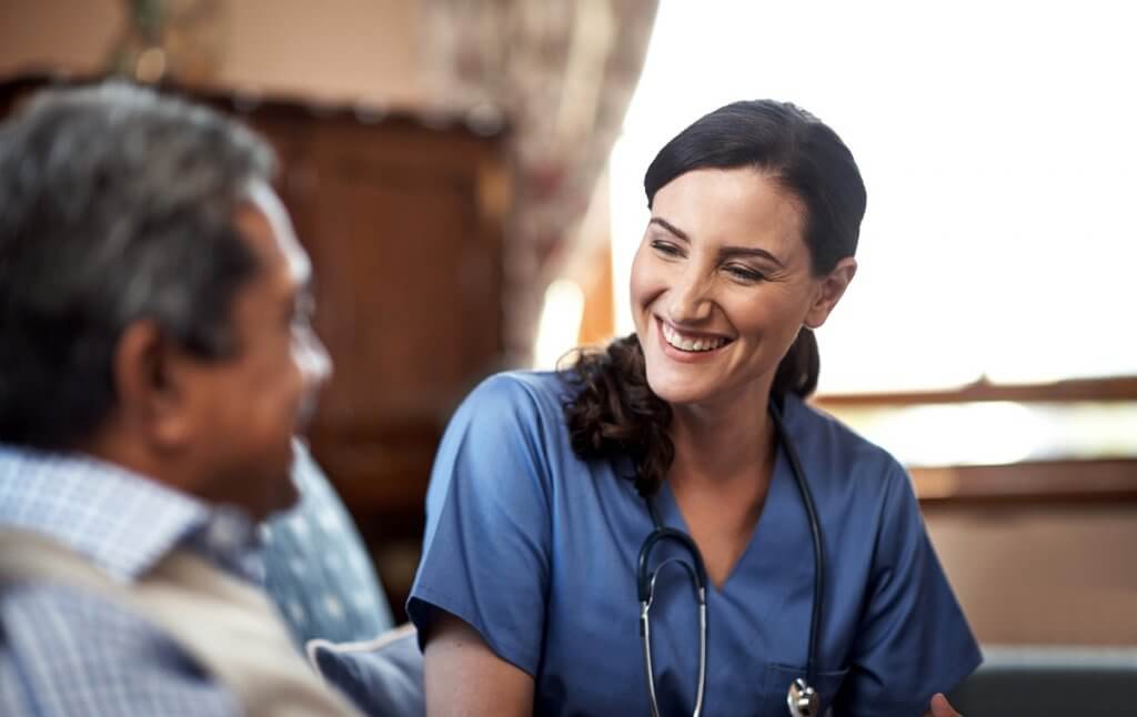Image of nurse and patient. One of the gifts nurses give is the gift of listening. 