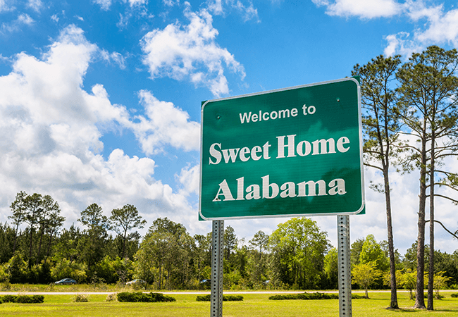 Alabama Governor Signs Bill Easing Nurse Restrictions - signs says welcome to sweet home Alabama